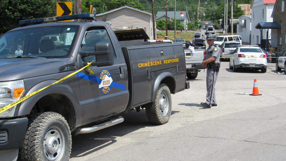 Kentucky State Police blocked off a street in Allen, a small town in Floyd County, Ky., on July 1, 2022 as the investigation continued into a shooting in which two police officers were killed.