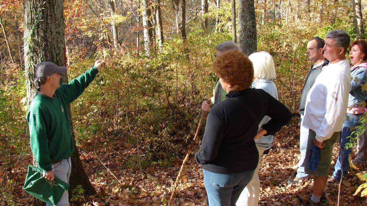 Bluegrass Woodland Restoration Center  consultant Julian Campbell, left, talked with a group touring Jessamine Creek Gorge. 