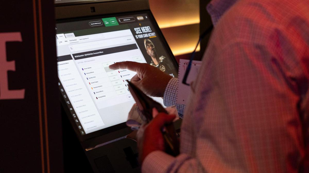 Sports gambling is legal in Kentucky. What’s it like to go to Red Mile and bet on sports?