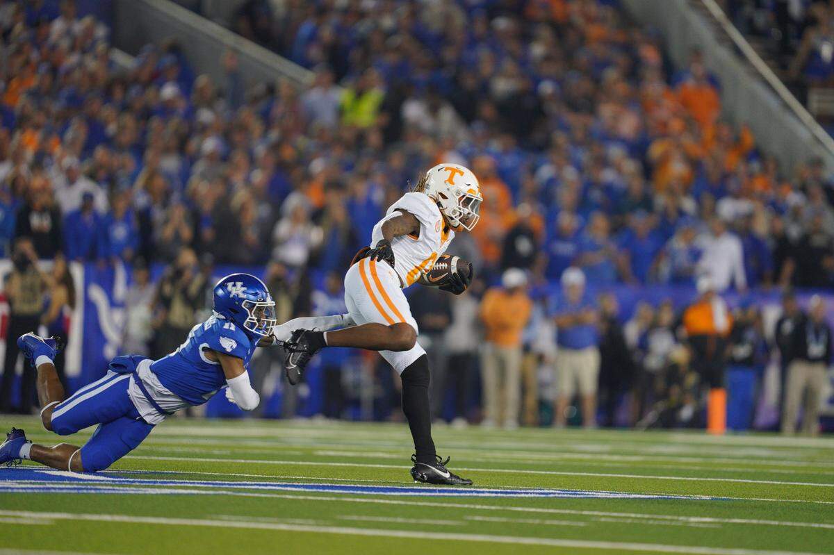 Tennessee’s Jaylen Wright eludes a tackle by Kentucky’s Zion Childress on his way to a touchdown during last Saturday’s Volunteers win. Missed tackles have been a problem for the Wildcats during their three-game losing streak.