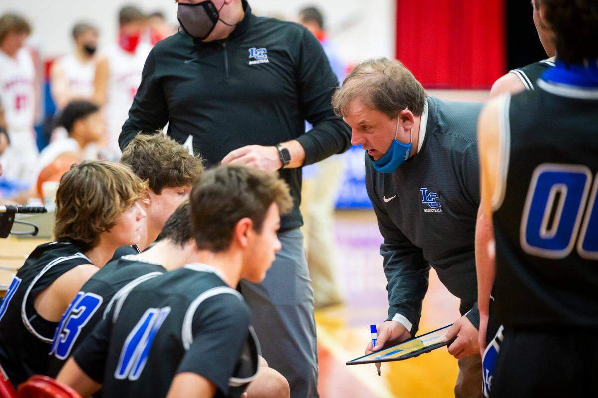 Lexington Catholic head coach Brandon Salsman talked to his players during a timeout at Lincoln County on Tuesday night. The Knights are 10-0 and ranked No. 3 in the state.