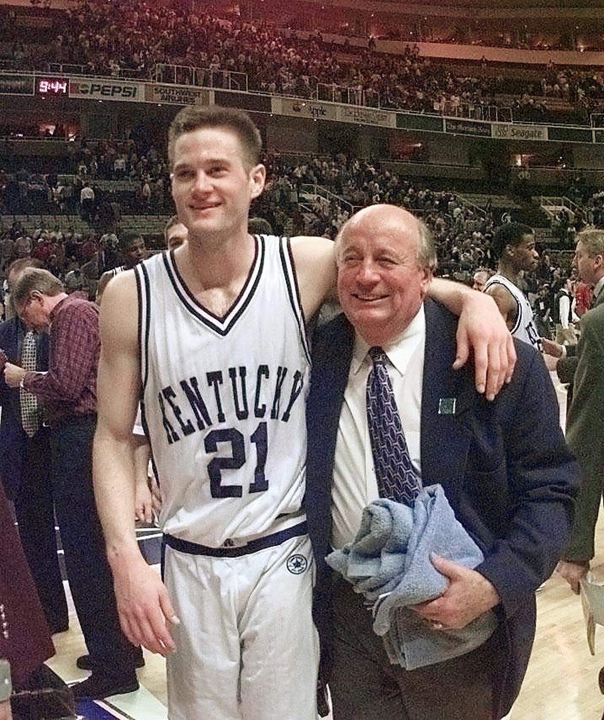 After scoring 19 points off the bench to spark Kentucky to an 83-68 win over Saint Joseph’s in the 1997 NCAA Tournament round of 16, Cameron Mills walked off the court with with veteran UK equipment manager Bill Keightley.