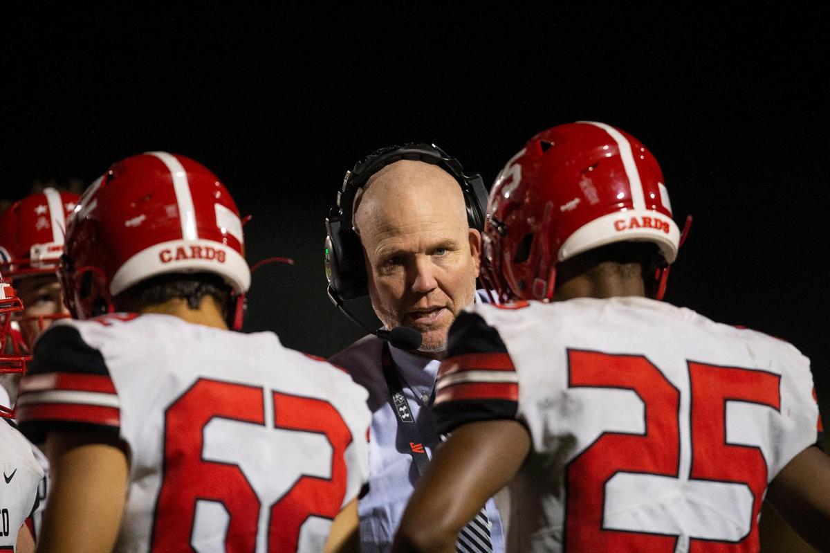 Scott County head coach Jim McKee talks to his players during a game in 2021. The Cardinals are Class 5A’s No. 1 team in the latest media poll.