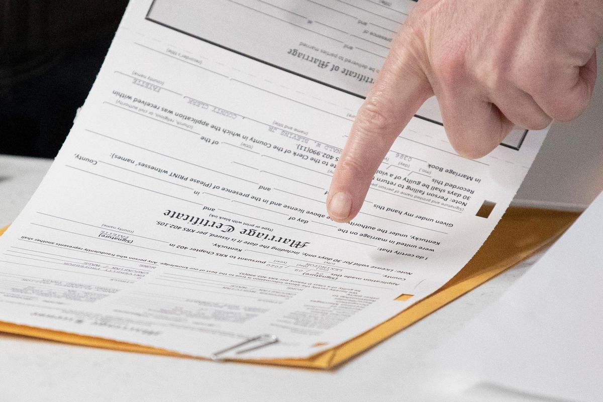 Couples were able to obtain marriage licenses outside the Fayette County Clerk’s office on the second floor of the Helix Garage in downtown Lexington, Ky., on Thursday, April 9, 2020.
