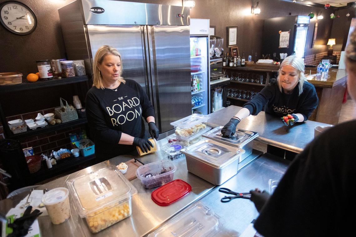 Shellie Hancock prepares charcuterie boards, including boards featuring chocolate fondue, at the Board Room Charcuterie and Wine in Morehead.