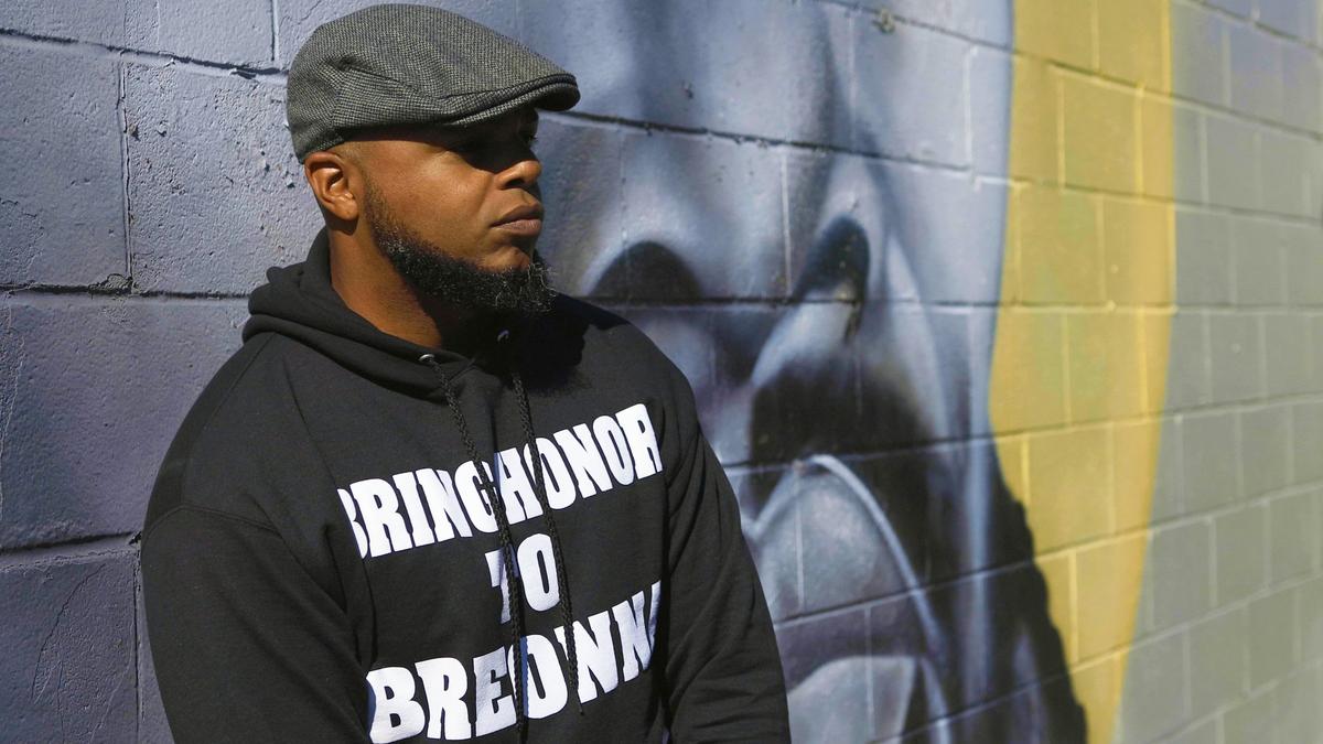 Social activist and hip-hop artist Richard Spaulding, better known through his alias Devine Carama, stands at a mural of rapper Nipsey Hussle painted on the side of Shopper’s Choice Market on Georgetown Street. He is raising awareness for Breonna Taylor and the systemic racism with his record and songs, including his 16 Bars for Breonna Taylor project posted to his SoundCloud. October 13, 2020.
