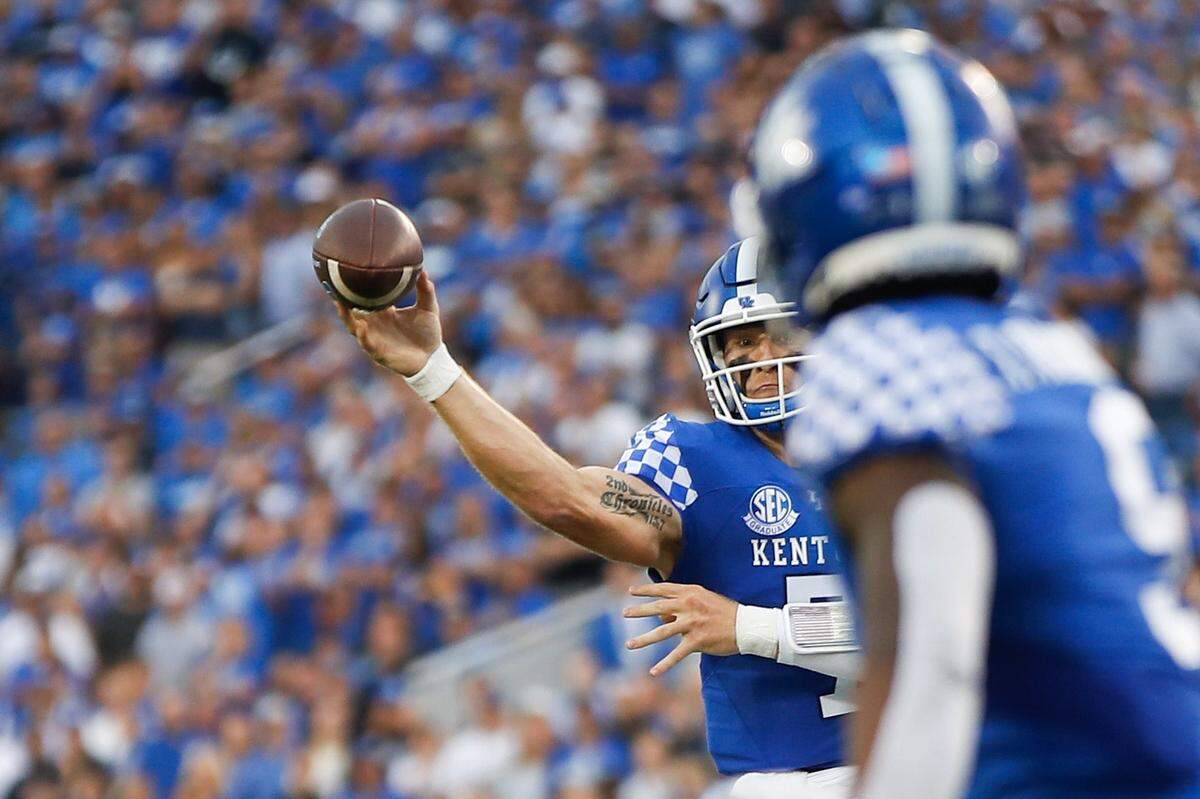 Kentucky’s Will Levis attempts a pass to Tayvion Robinson in the first half against Miami (Ohio). Levis completed 21 of 32 passes in the season opener for 303 yards with three touchdowns and one interception.