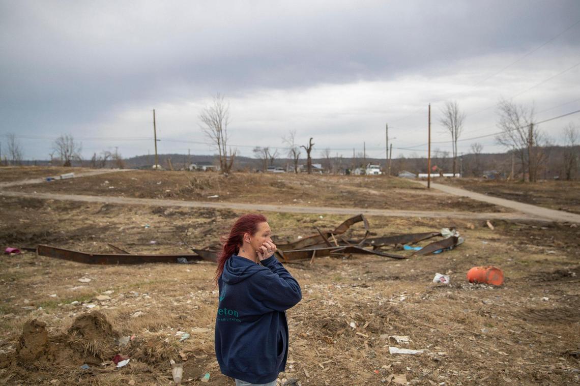 Toskia Adamson stands at the site of her mother’s home in Dawson Springs, Ky., Friday, Feb. 11, 2022. During the Dec. 10, 2021, historic quad-state tornadoes that scoured a path of destruction nearly 200 miles, most of which was in Kentucky, Adamson’s mother and son were sucked out of the home and flung into the air.