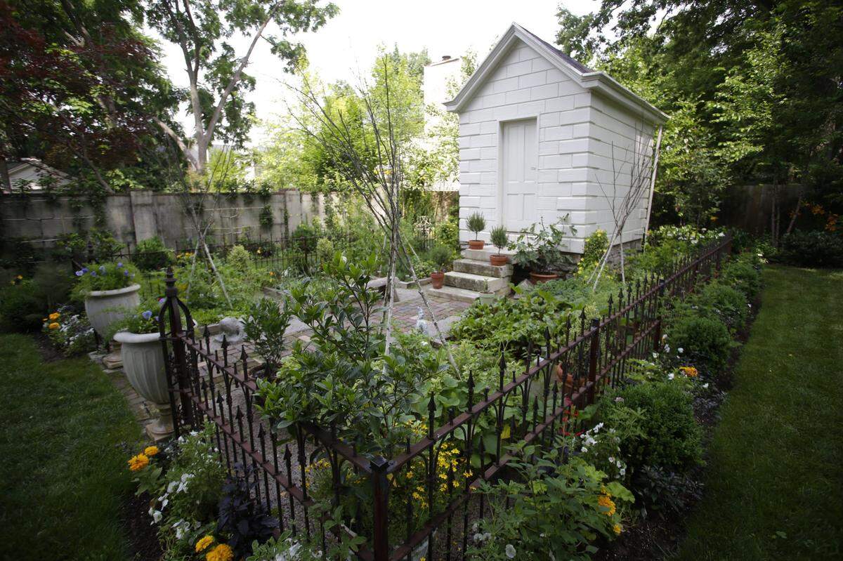 Jon Carloftis and partner Dale Fisher restored the grounds and garden of historic Botherum on Madison Place as well as the house.