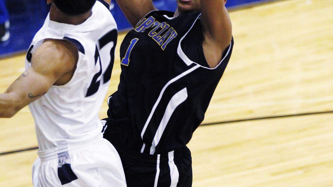 Henry Clay's Christen Cunningham scored past Daquan Boyd in the fourth quarter of the Moore vs Henry Clay boy's high school basketball game during the Republic Bank Holiday Classic at Lexington Catholic High School in Lexington, Ky., on Dec. 28, 2011. Henry Clay beat Moore 77-73. Photo by Pablo Alcala | Staff




    