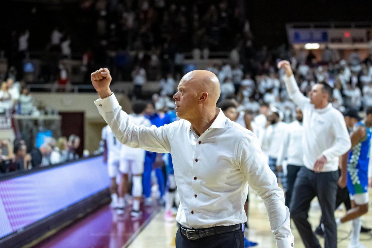 Eastern Kentucky coach A.W. Hamilton celebrates after his team beat Florida Gulf Coast at Baptist Health Arena in Richmond on Feb. 7.