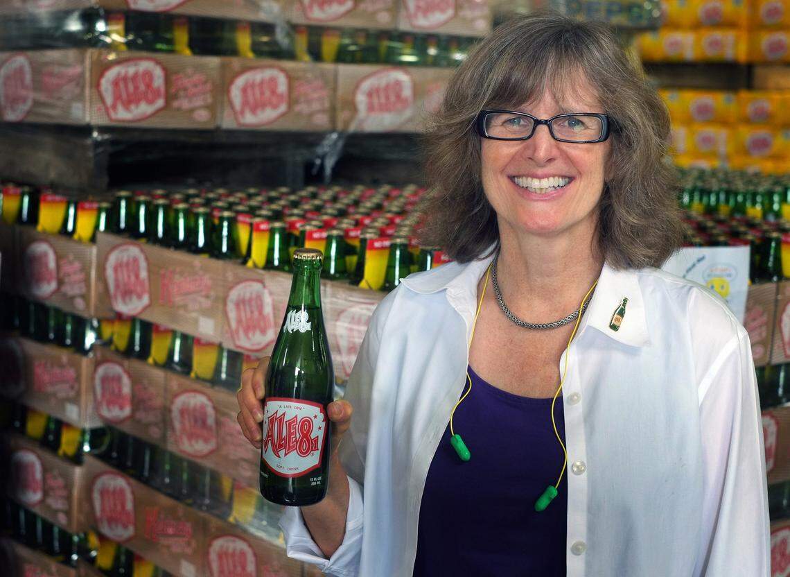 Ale-8-One president and CEO Ellen McGeeney posed with one of the iconic longneck green bottles in 2014.