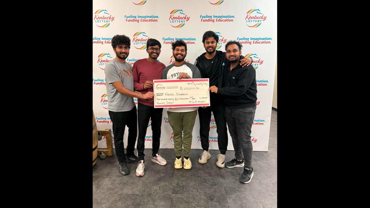 Rohith Kandula, picked center, poses with his lottery winnings alongside his fellow University of Cincinnati graduates.