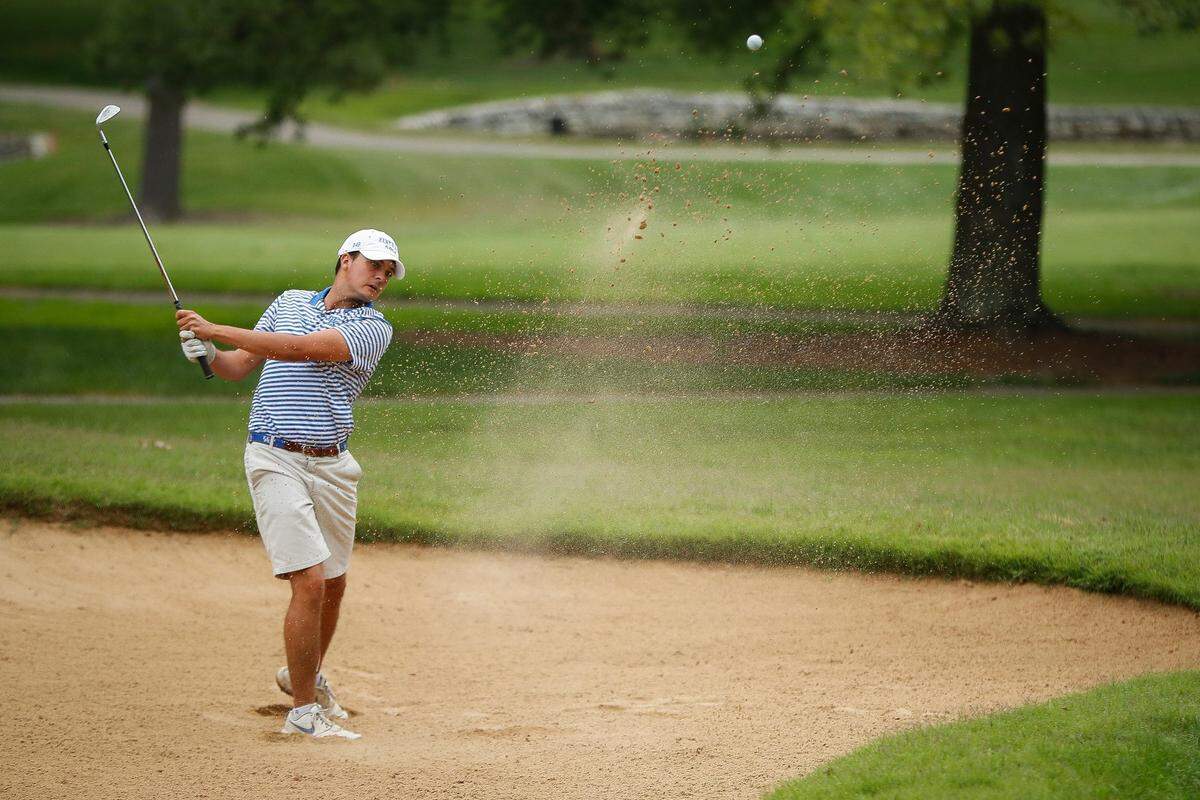 University of Kentucky sophomore Alex Goff chipped out of a bunker during the final round of the 106th men’s Kentucky State Amateur golf tournament at Lexington Country Club on Friday. Goff won the tournament by four strokes.