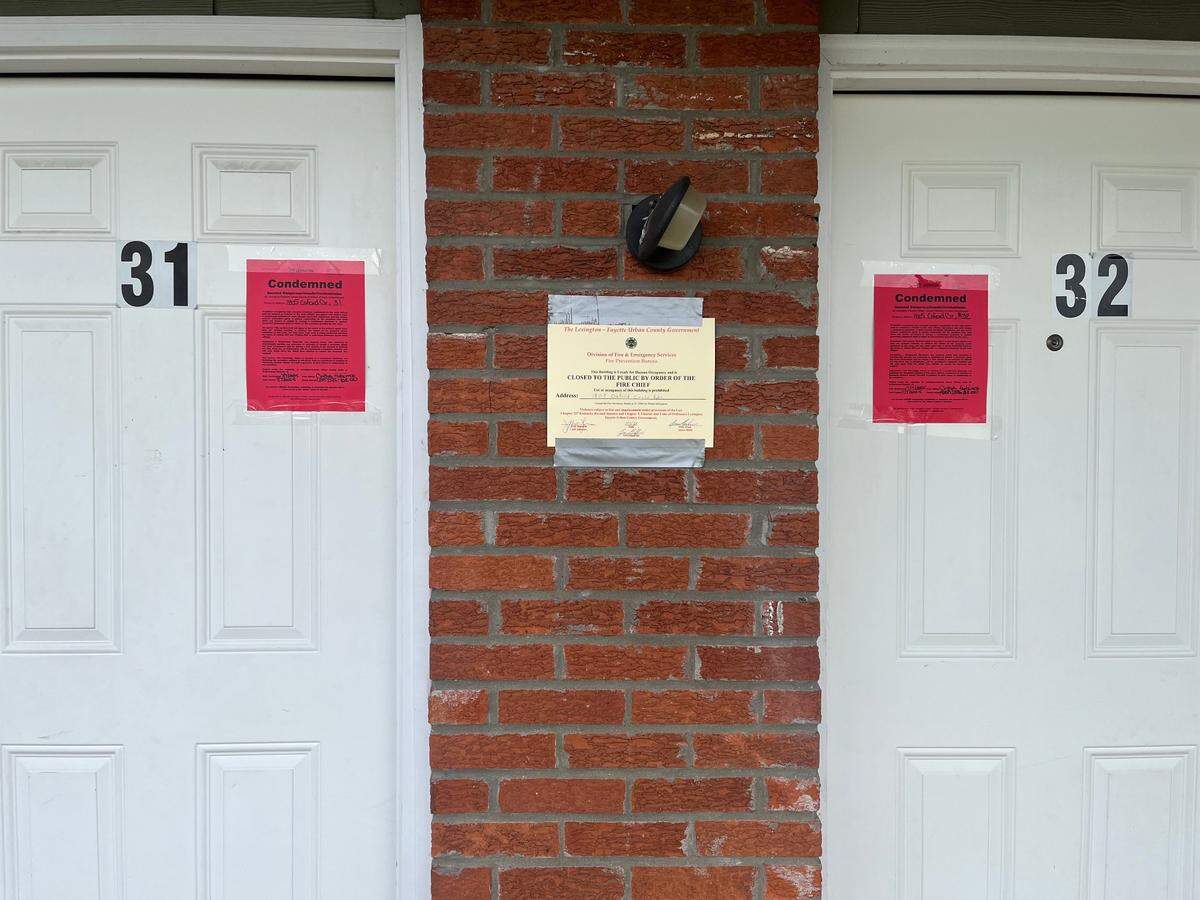 Condemned notices are posted outside two units of the Oxford Circle apartment complex after a deadly gas leak on July 7, 2025.