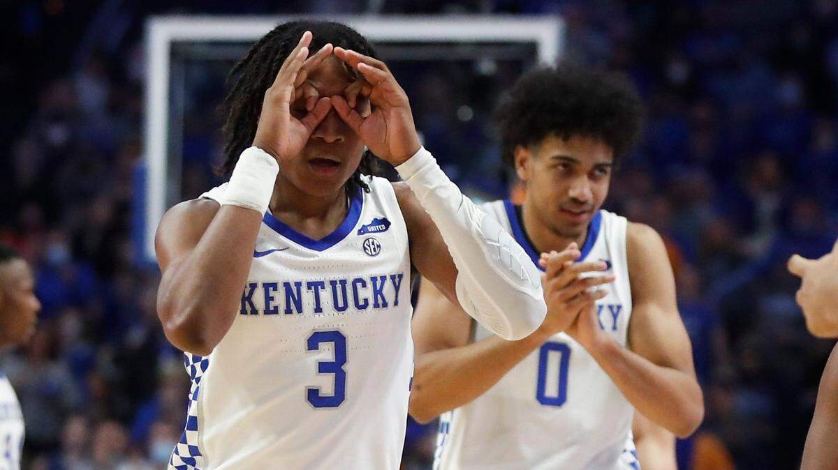 Kentucky Wildcats guard TyTy Washington Jr. (3) and Kentucky Wildcats forward Jacob Toppin (0) celebrate during a game against the Tennessee Volunteers at Rupp Arena in Lexington, Ky., Saturday, Jan. 15, 2022.