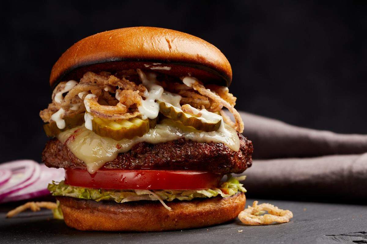 Firebirds Wood Fired Grill’s Durango Burger, which is chili spiced and served with pepper jack cheese, fried onions and roasted garlic ranch dressing.