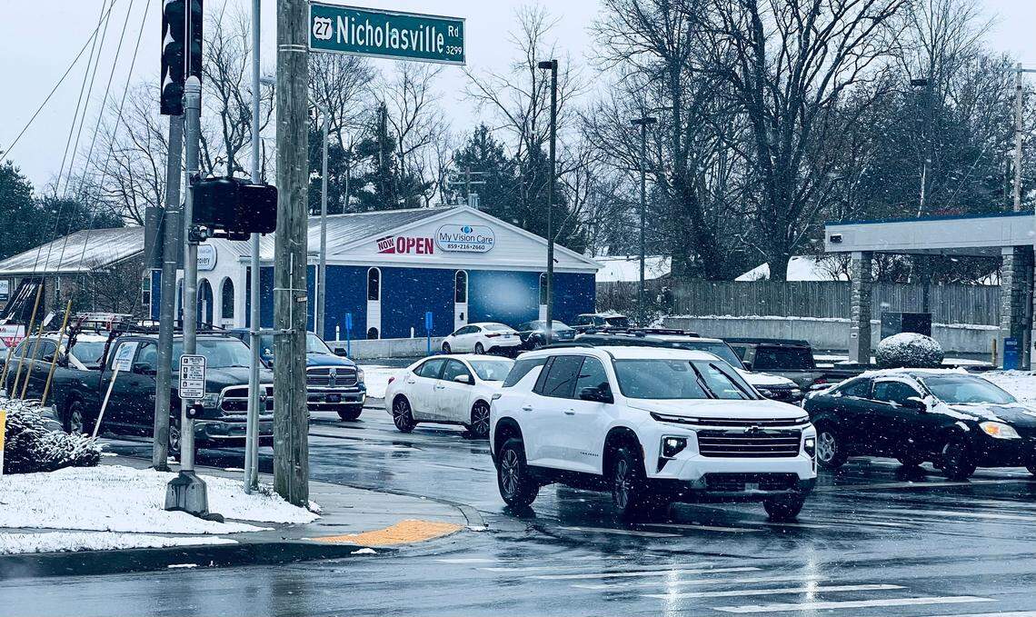 Snow flurries swirl during inclement weather on Nicholasville Road Dec. 8, 2025, in Lexington, Ky.