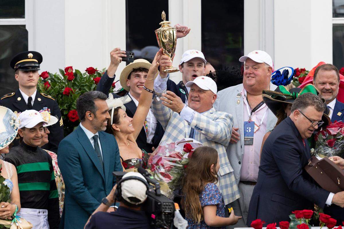 Trainer Kenneth McPeek celebrates winning the 150th running of the Kentucky Derby with Mystik Dan and Brian Hernandez, Jr. at Churchill Downs in Louisville, Ky, Saturday, May 4, 2024.