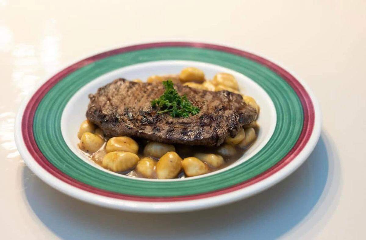 The Steak filet and gnocchi at Milano Italian Restaurant is a 10 oz. ribeye steak with herb butter served overgnocchi pasta and tossed in a veal demi sauce ($28.99).