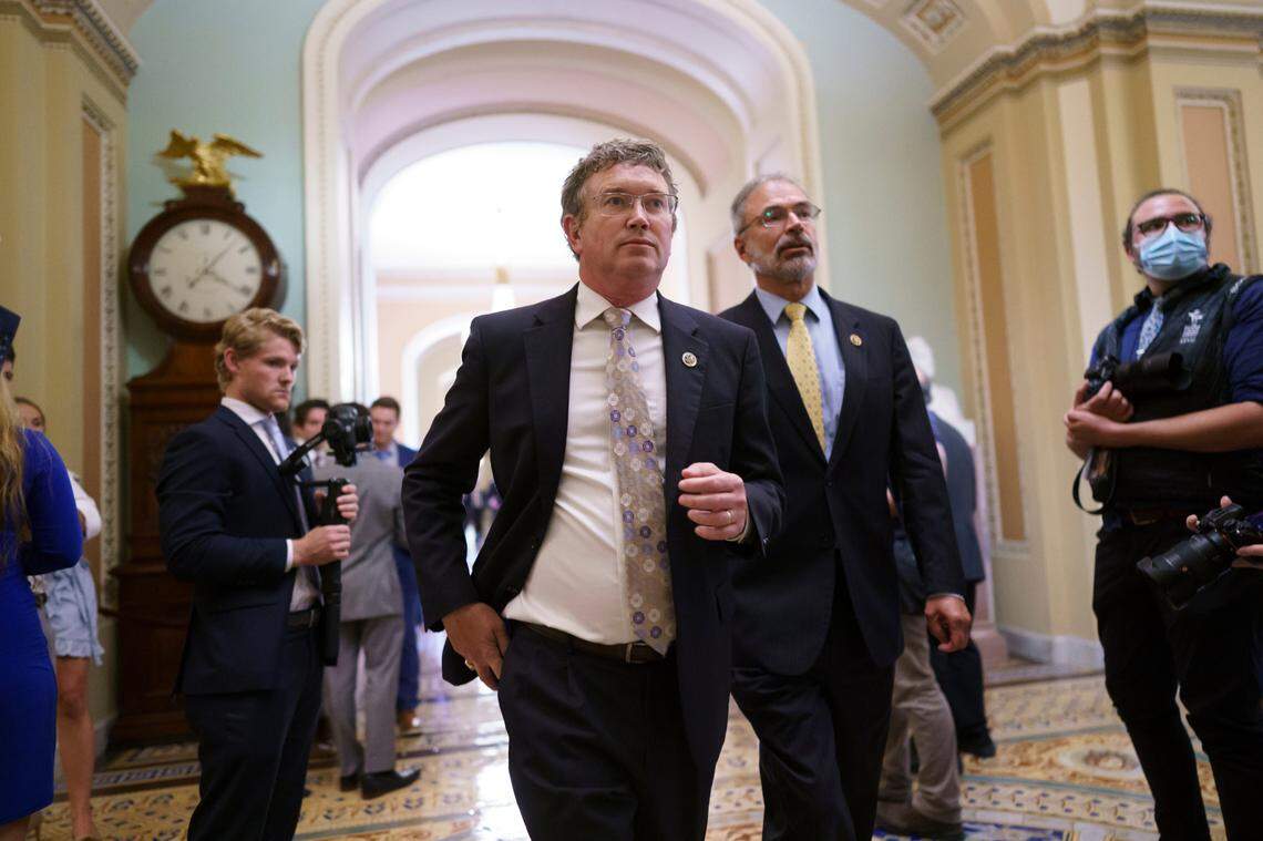 Rep. Thomas Massie, R-Ky., left, Rep. Andy Harris, R-Md., and other conservative members of the House walk to the Senate chamber, as they express their opposition to new mask guidance, at the Capitol in Washington, Thursday, July 29, 2021. Earlier in the day, House Minority Leader Kevin McCarthy, R-Calif., charged that the Centers for Disease Control has become a political arm of the administration. (AP Photo/J. Scott Applewhite)