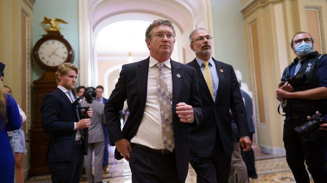 Rep. Thomas Massie, R-Ky., left, Rep. Andy Harris, R-Md., and other conservative members of the House walk to the Senate chamber, as they express their opposition to new mask guidance, at the Capitol in Washington, Thursday, July 29, 2021. Earlier in the day, House Minority Leader Kevin McCarthy, R-Calif., charged that the Centers for Disease Control has become a political arm of the administration. (AP Photo/J. Scott Applewhite)