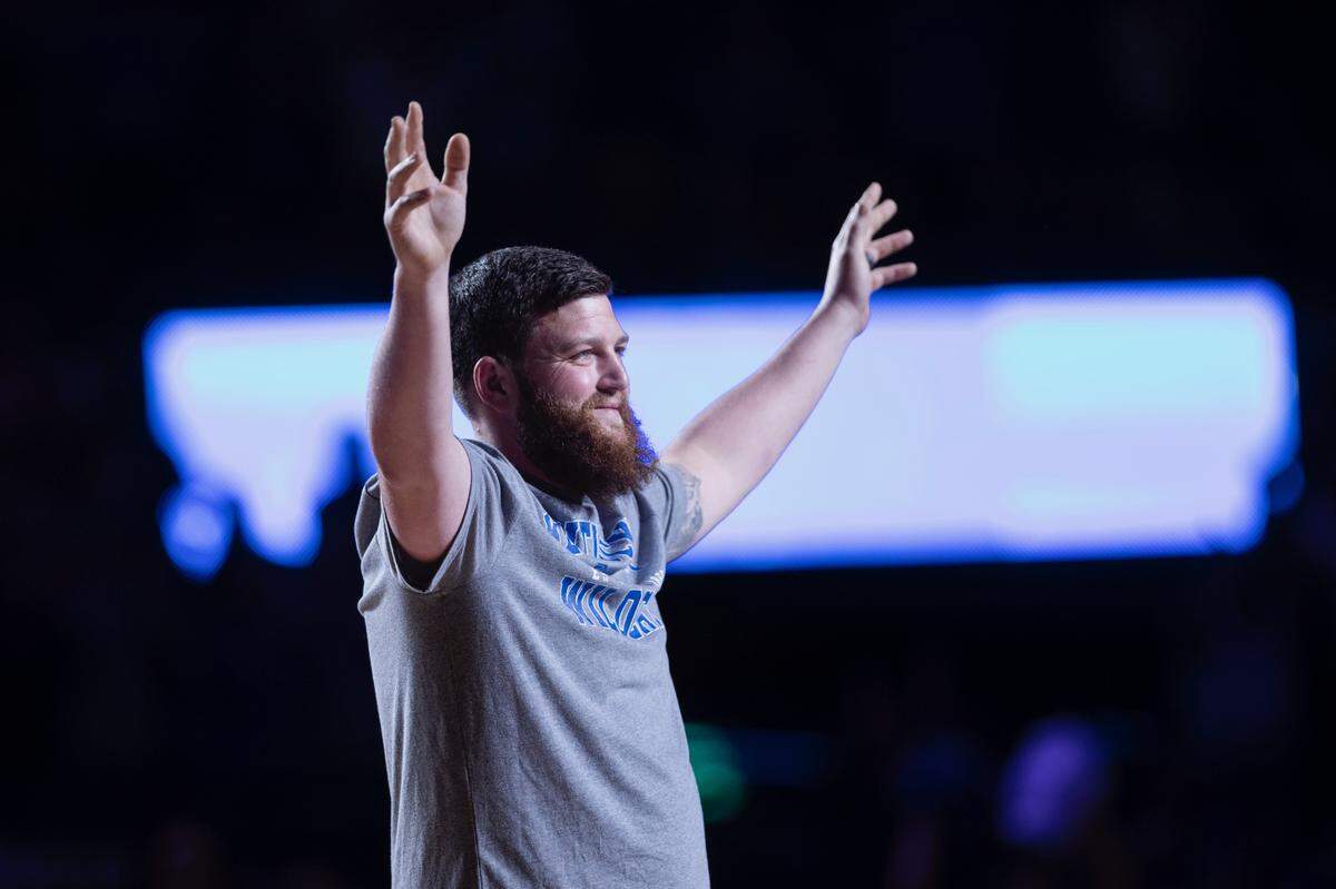 Michael McGuire makes the “Y” in Kentucky in front of the Rupp Arena crowd on Friday night.