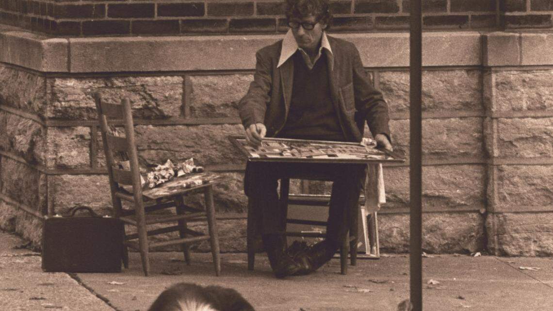 Lexington artist Henry Faulkner worked on a painting of the Hunt Morgan House while sitting on the sidewalk at the southeast corner of Mill and Second streets in 1972. His dog Gentry used the time to take a nap.