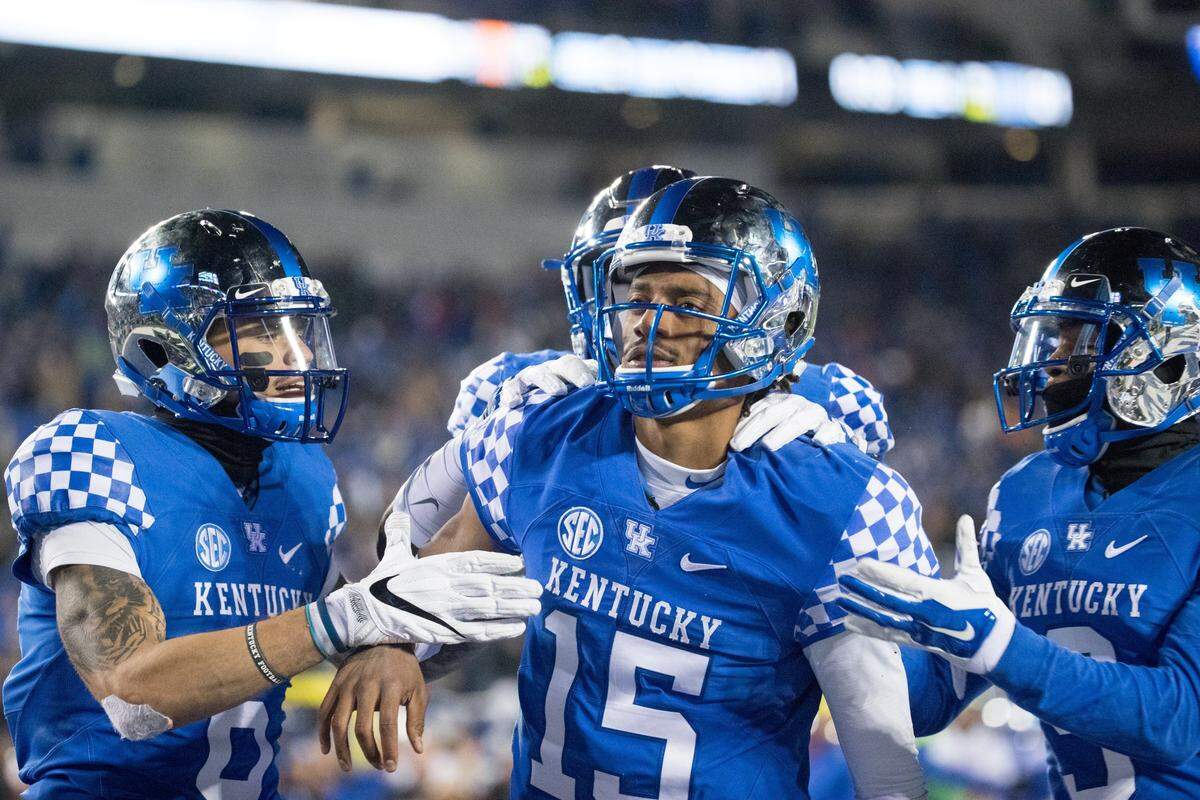 Kentucky quarterback Stephen Johnson (15) and the Cats donned chrome helmets, blue jerseys and blue pants for last season’s matchup with Tennessee.