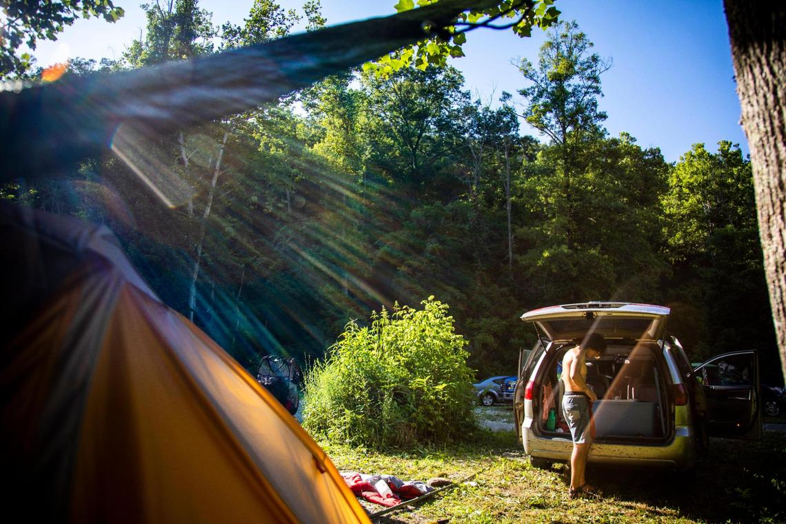 Oliver Vickers Batzdorf, 19, organizes clothes and belongings July 14 in his van that he is living out of while working at Miguel’s Pizza in Slade. Vickers Batzdorf and his younger brother Robbin are from New York City and moved to Kentucky to work and live at Miguel’s and spend their off time outdoors hiking and climbing.