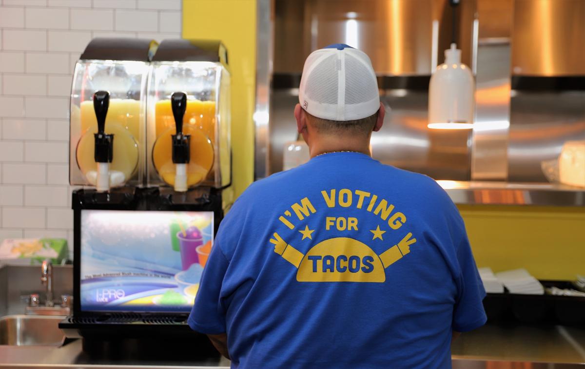 Gerardo Ochoa, one of the managing partners of Bandido Taqueria Mexicana, wore a “I vote for tacos” t-shirt while making drinks during the restaurant’s soft opening on Wednesday evening, Sept. 23, 2020. The Southern California-style taqueria officially opens to the public on Sept. 25.