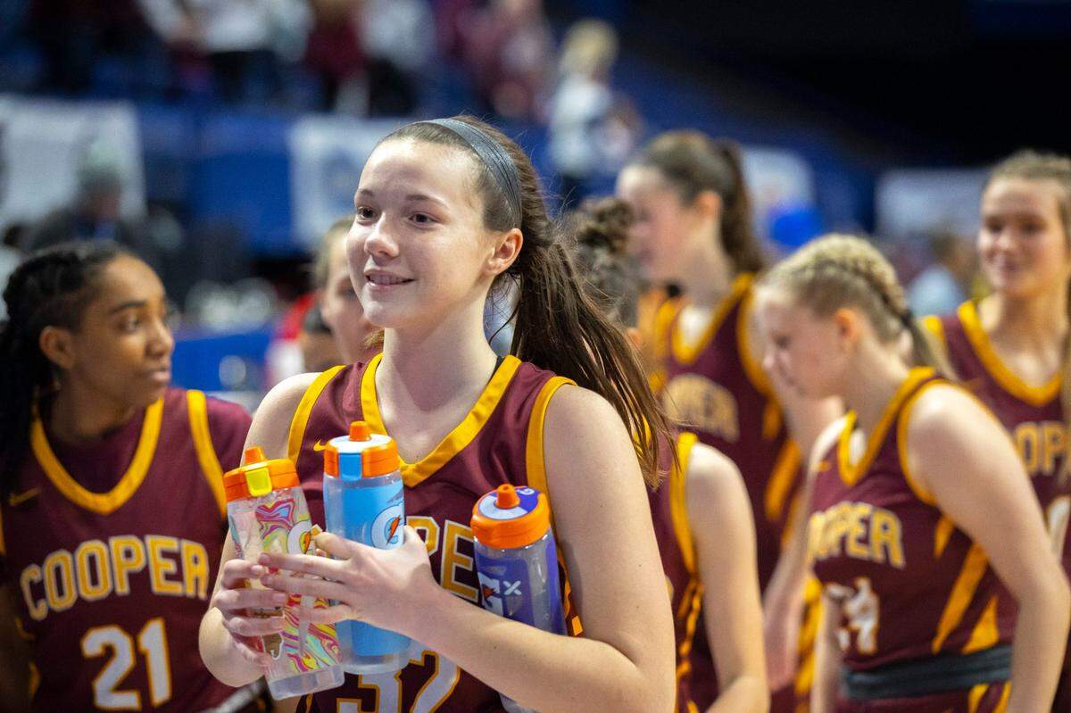 “We’re definitely just going out there and trying to carry on his legacy, trying to be positive, always working hard,” Liz Freihofer (foreground) said of her uncle John Schlarman. “Get it done, just like he would.”