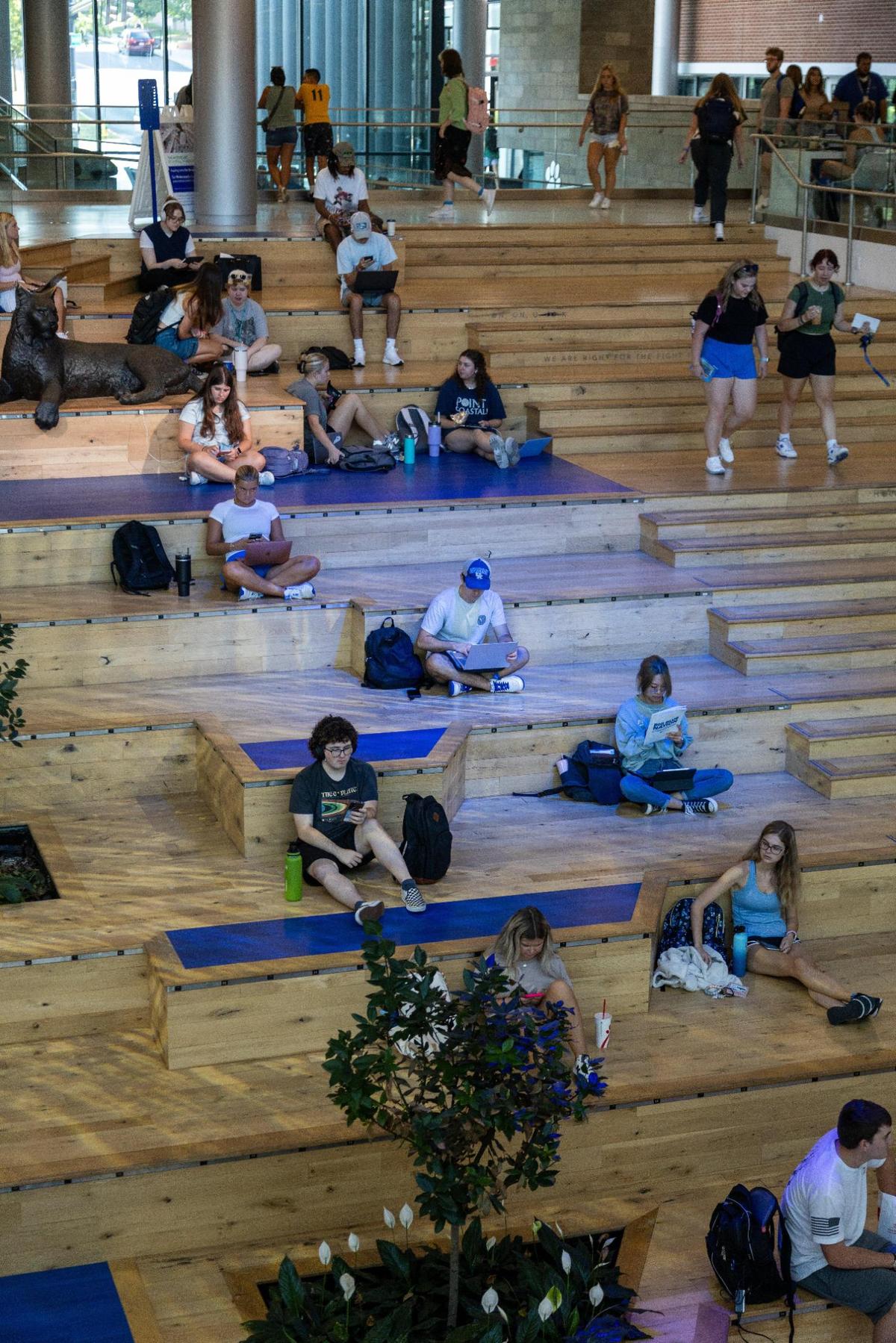 Students gather within several communal areas of UK’s Gatton Student Center between classes, August 21, 2023.