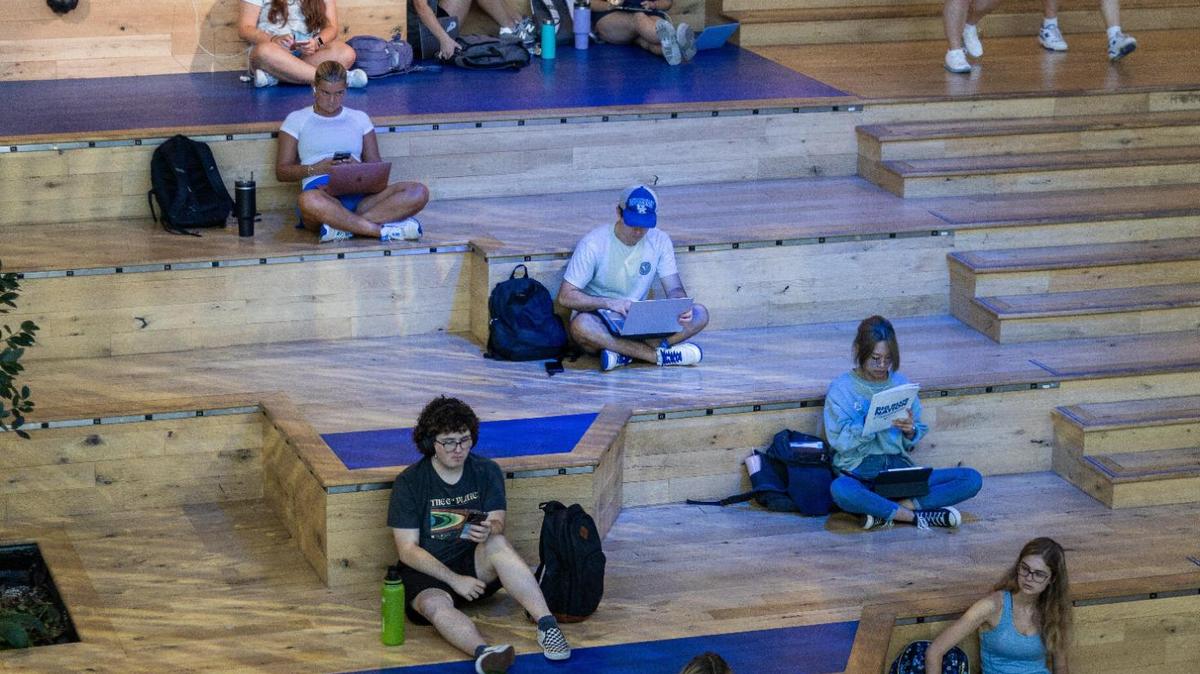 Students gather within several communal areas of UK’s Gatton Student Center between classes, August 21, 2023.