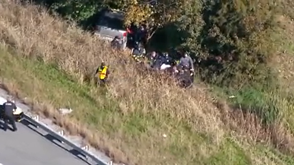 Police say a woman spent a night in a wrecked SUV while waiting to be found after a crash off Interstate 65 in Shepherdsville, Kentucky.