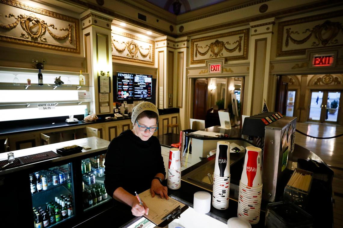 Candace Hensley takes inventory Tuesday at the concession stand at the Kentucky Theatre in Lexington.