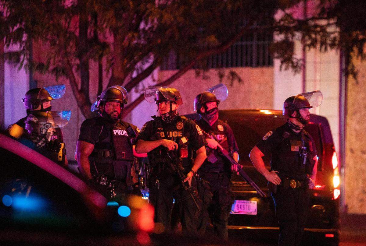 Louisville Metro Police block off Broadway after two officers were shot and a suspect was taken into custody after a march in protest of the decision concerning the officers involved in the killing of Breonna Taylor announced earlier today in Louisville, Ky., Wednesday, September 23, 2020.