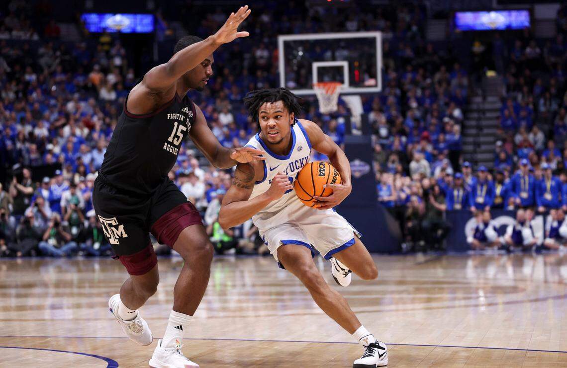 Kentucky’s D.J. Wagner (21) dribbles against Texas A&M’s Henry Coleman III (15) during the SEC Tournament quarterfinals at Bridgestone Arena in Nashville.