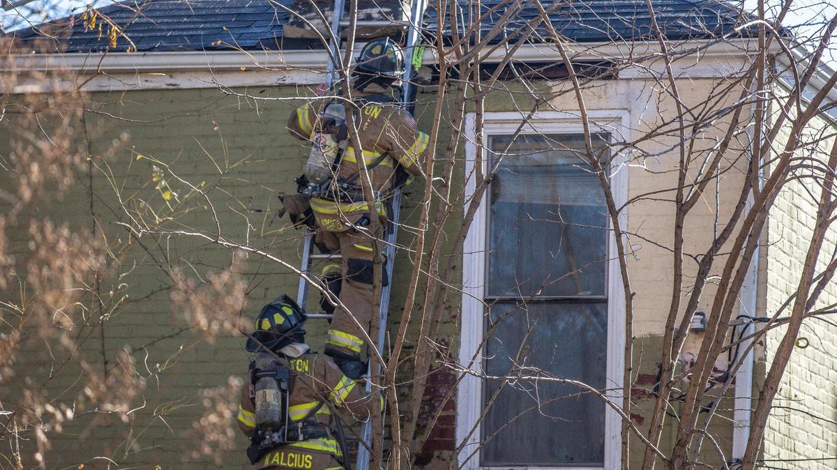 Members of the Lexington Fire Department respond to a structure fire on West Fifth Street in Lexington, Ky., on Thursday, Dec. 2, 2021.
