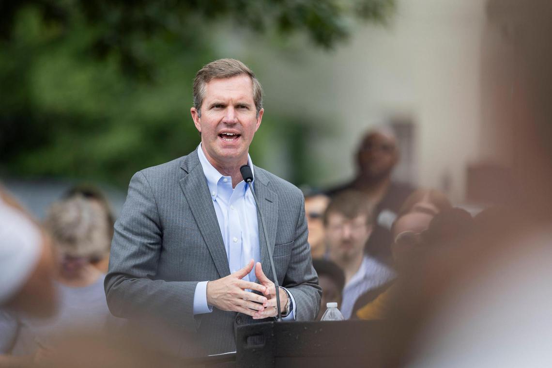 Governor Andy Beshear speaks during the ‘Towards Freedom’ monument unveiling on Thursday, June 19, 2025, at the corner of North Limestone and Fourth Street in Lexington, Ky.