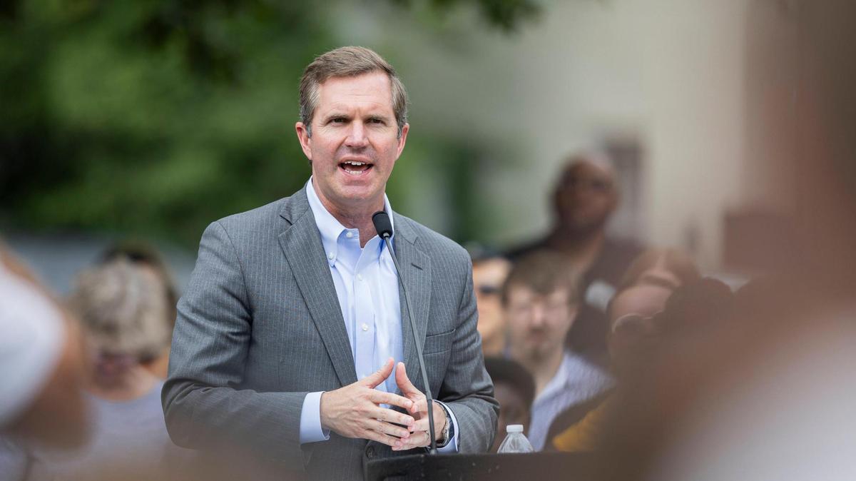 Governor Andy Beshear speaks during the ‘Towards Freedom’ monument unveiling on Thursday, June 19, 2025, at the corner of North Limestone and Fourth Street in Lexington, Ky.