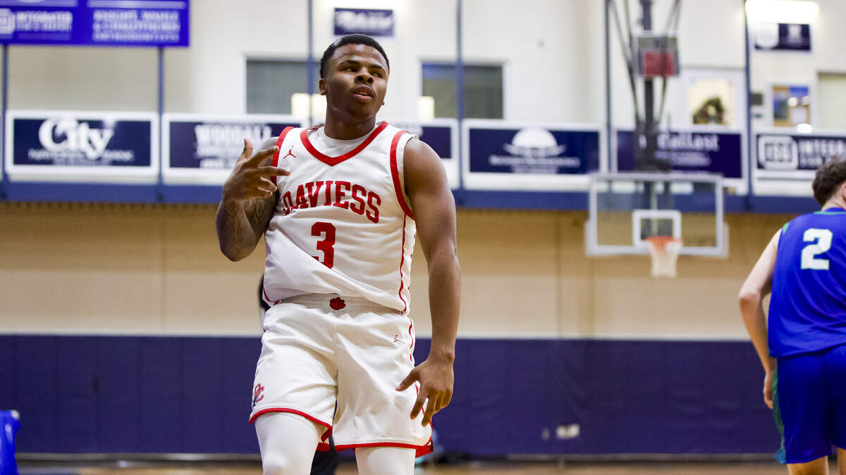 Daviess County’s Lemontae Ratcliff celebrated his made 3-pointer during in the semifinals of the White, Greer & Maggard Holiday Classic at Lexington Catholic High School on Monday.