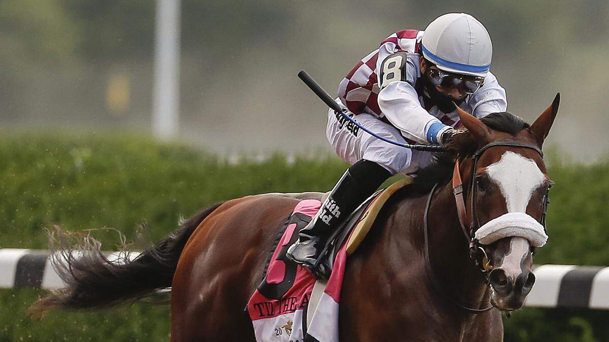 Tiz the Law (8), with jockey Manny Franco up, approaches the finish line on his way to win the152nd running of the Belmont Stakes horse race, Saturday, June 20, 2020, in Elmont, N.Y.