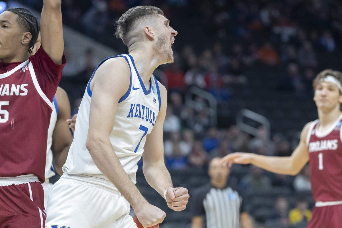 Kentucky forward Andrew Carr reacts after scoring a basket against Troy in a first-round NCAA Tournament game at Fiserv Forum in Milwaukee.