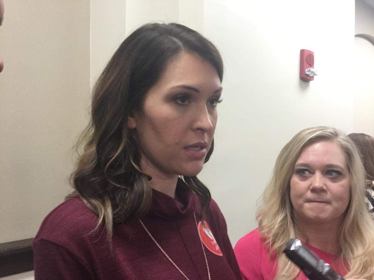 April Lanham, who is 18 weeks pregnant and expecting her fourth child, allowed a fetal Doppler to be placed on her belly during a Kentucky Senate committee’s hearing on a bill that bans abortion once a fetal heartbeat is heard.
