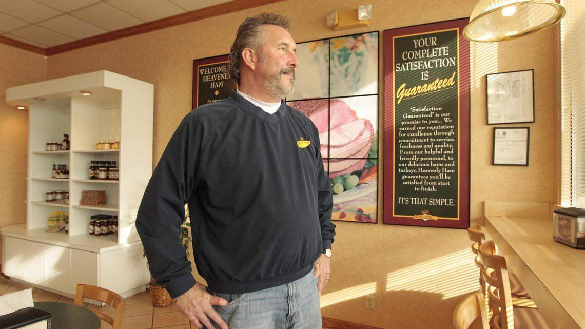 Louis Hager, owner of Heavenly Ham, on Thursday, the last day his store was open for business at The Mall at Lexington Green. The store will reopen in March at the nearby Regency Center.  Photo by Pablo Alcala | Staff