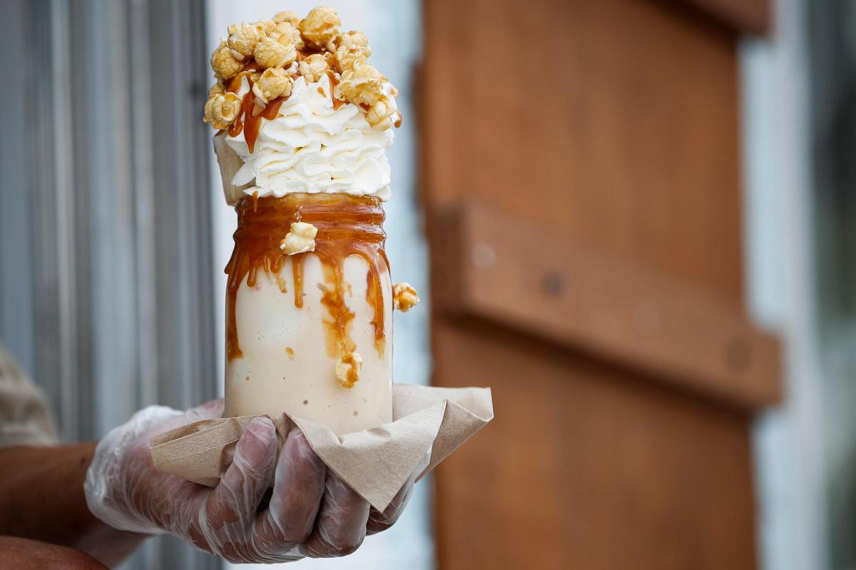The Salted Caramel Cattywampus Milkshake made with Blue Bell Sea Salt Caramel, homemade caramel sauce, whipped cream and butter toffee popcorn at Georgetown’s Sweet Matriarch Bakery. All the cupcakes, cookies and other items that “garnish” the shakes are made in-house.