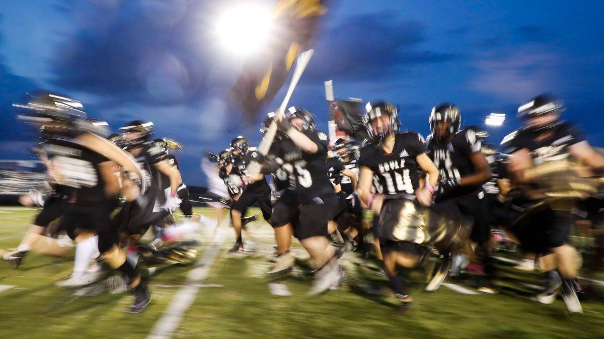 Boyle County’s players ran onto the field ahead of their game against Lexington Catholic in Danville on Oct. 8. The Rebels won 16-10.