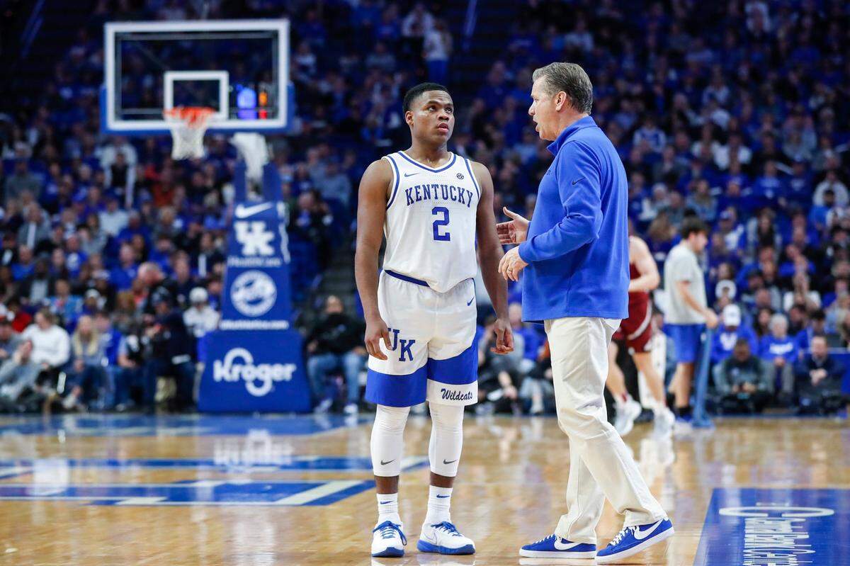 Kentucky guard Sahvir Wheeler (2) talks with head coach John Calipari during Tuesday’s game against South Carolina.