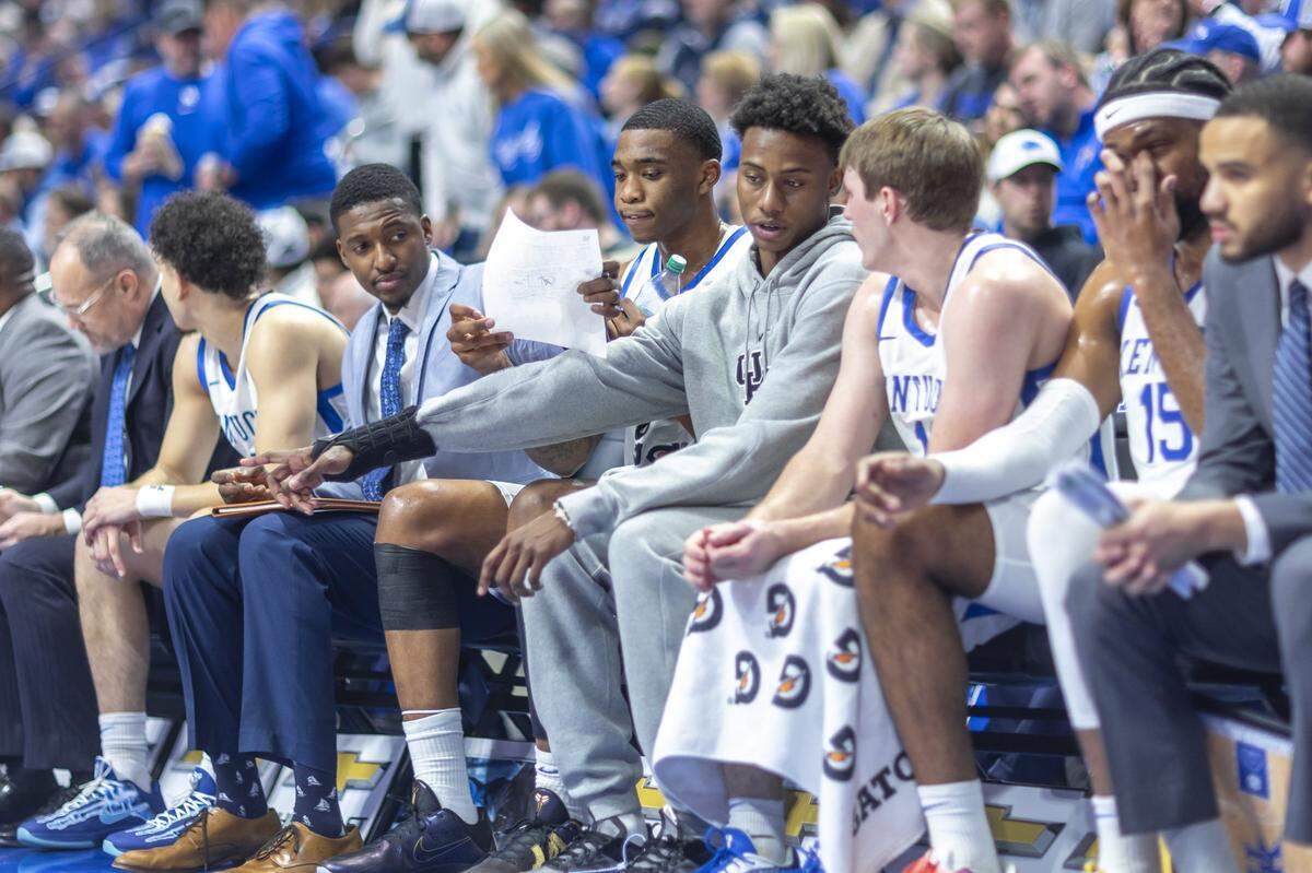 Kentucky guard Jaxson Robinson, with brace on right wrist, talks with Wildcats guard Travis Perry during a game against the Tennessee Volunteers on Feb. 11.